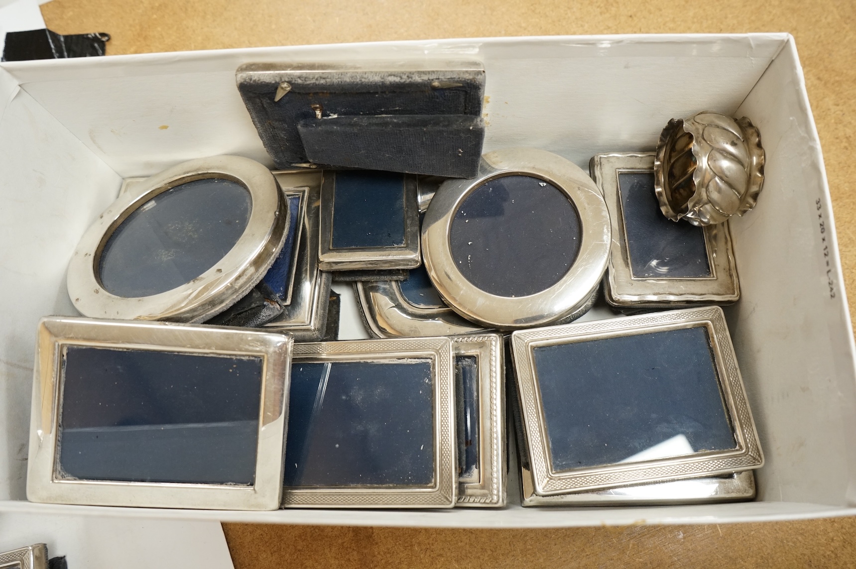 Four assorted pairs of modern silver mounted photograph frames, including Carr's Of Sheffield, 1992/3 and 1990, together with twelve other small assorted modern silver mounted photograph frames, largest 12.9cm and a silv